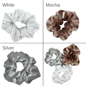 velvety velour scrunchies 4 shown in a variety of neutral colors