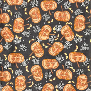 closeup image headband fabric of pumpkins and spiderwebs