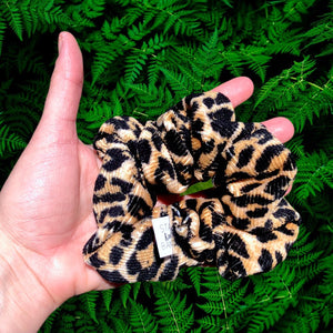 animal print ribbed knit scrunchie in hand